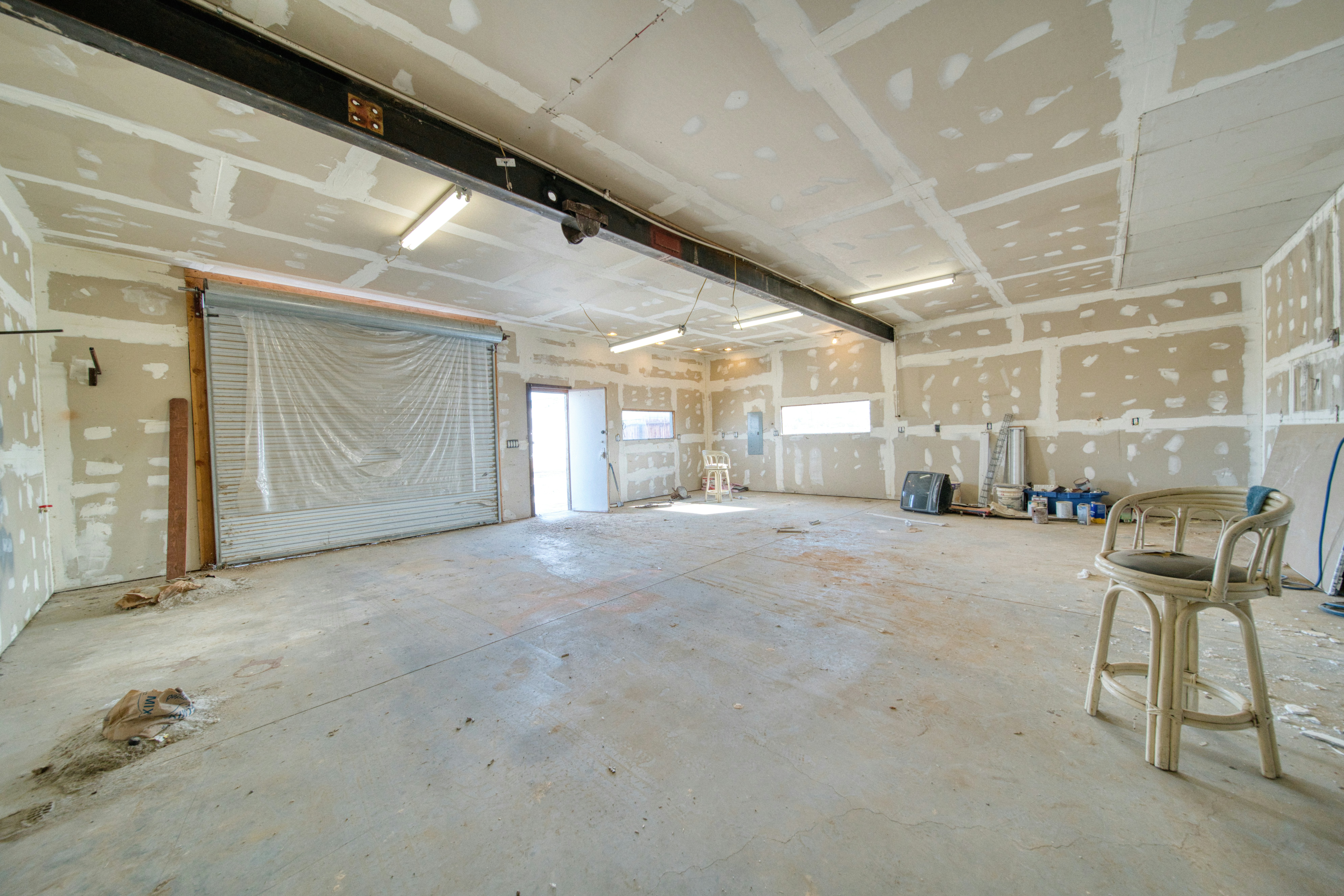 Interior space with drywall installation in progress