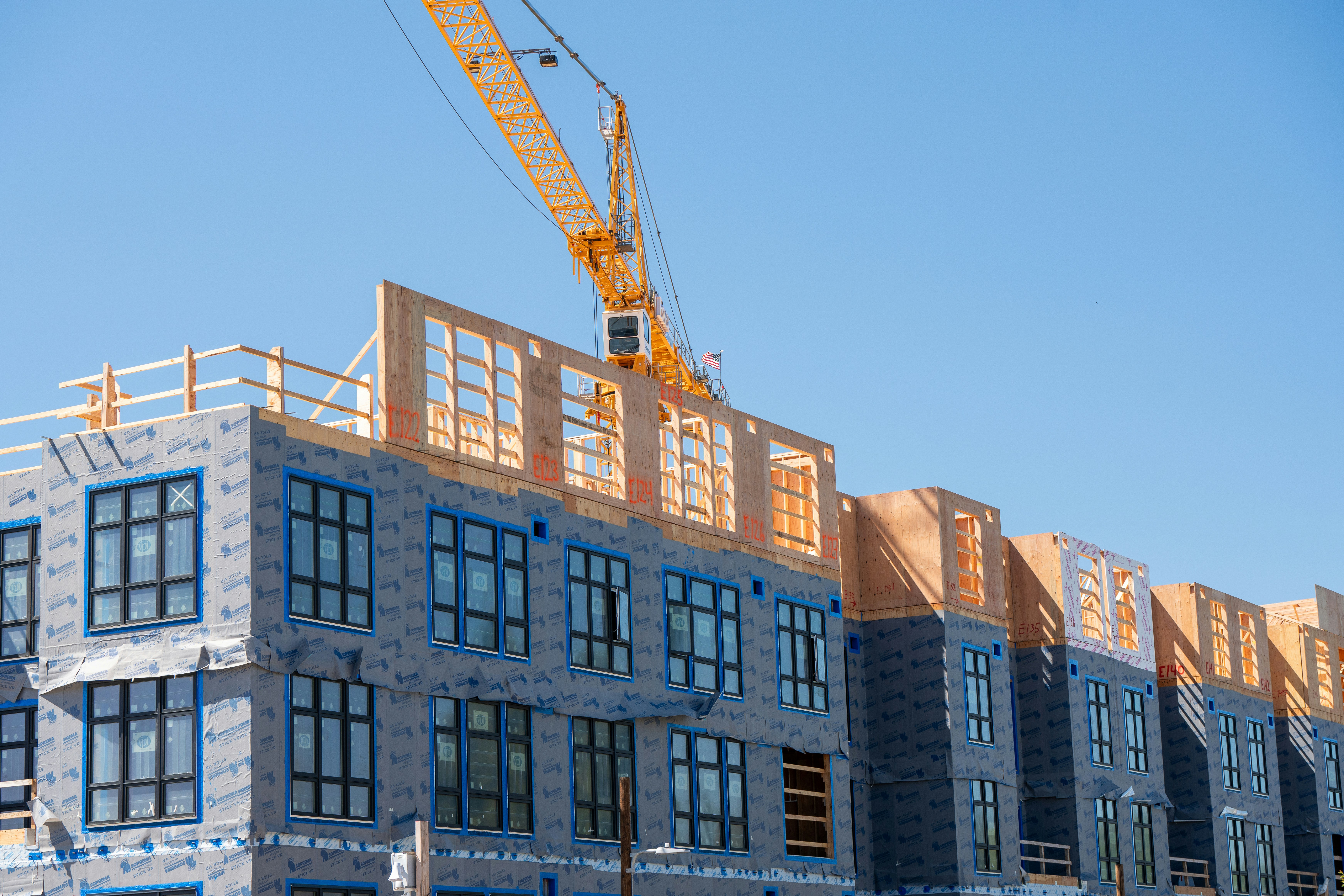 Paving crew with asphalt equipment on road